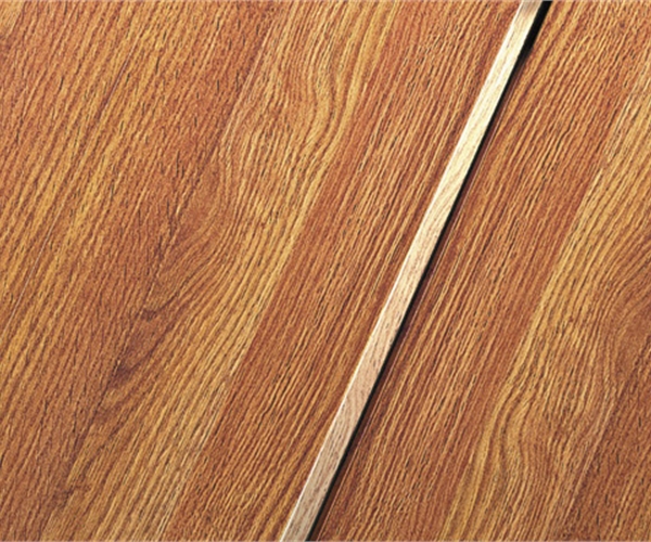Laminates are a High Density Fiberboard with a paper photocopy of the design such as a wood plank.  the quality of the laminate depends on the quality of the HDF, the paper and dye qualities along with the locking system used.